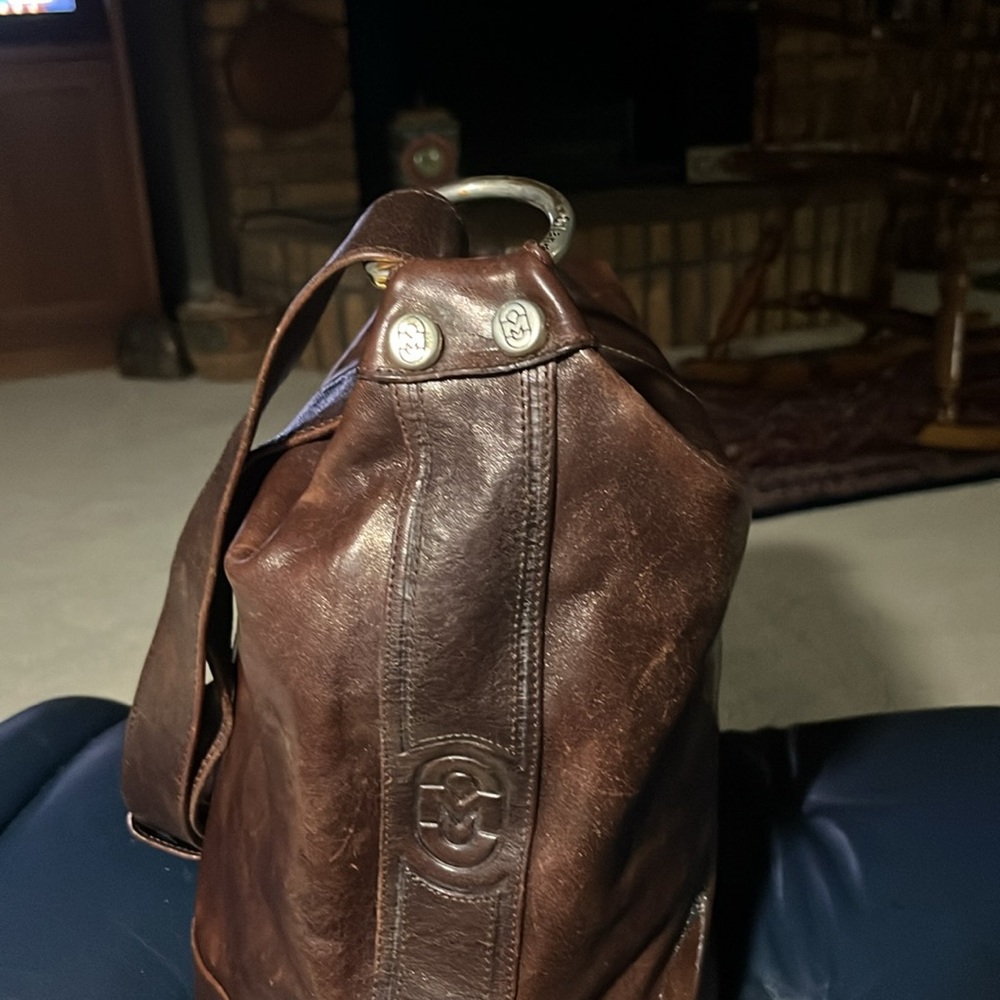 Large brown leather purse made by Marino Orlandi in Italy.